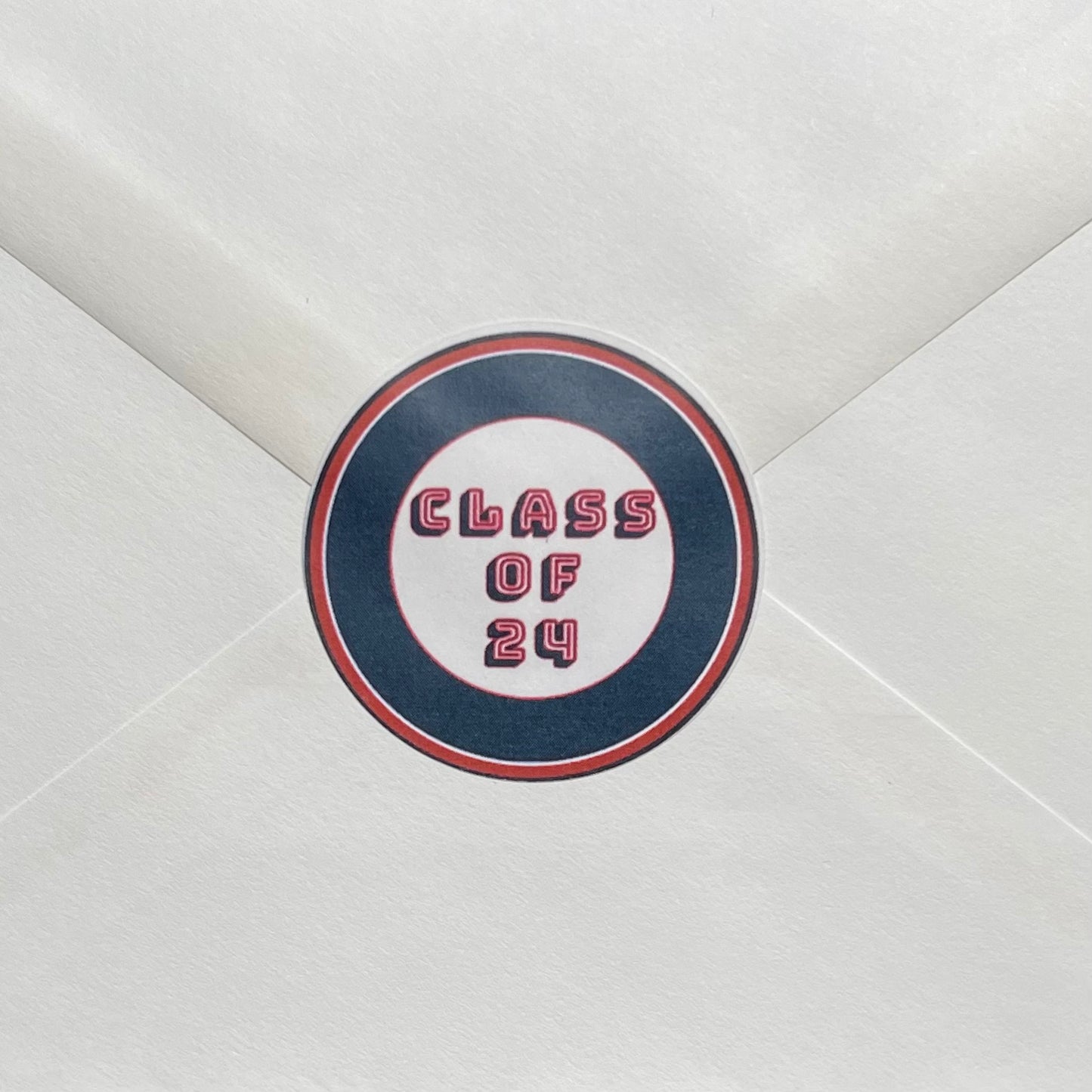Outer envelope seal with “Class of (grad year)” in official school colors.